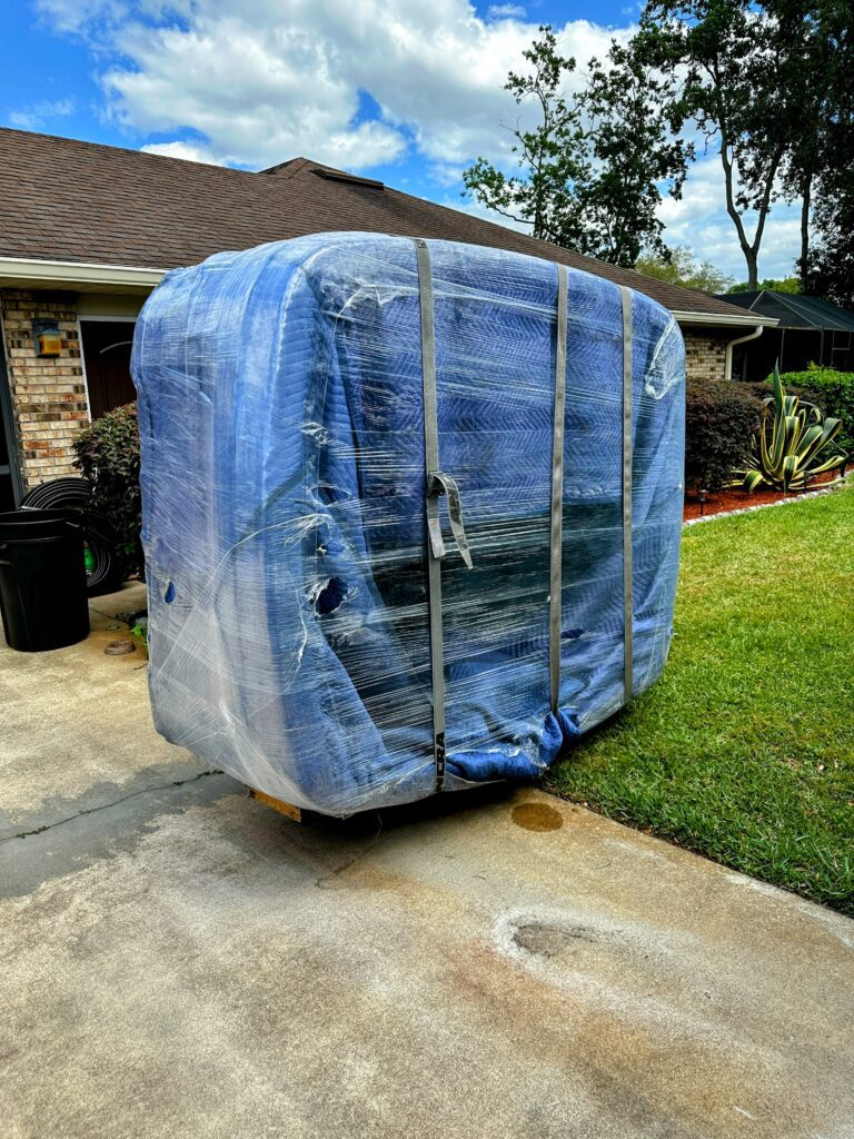 Furniture fully wrapped and banded by Black Swan Moving movers