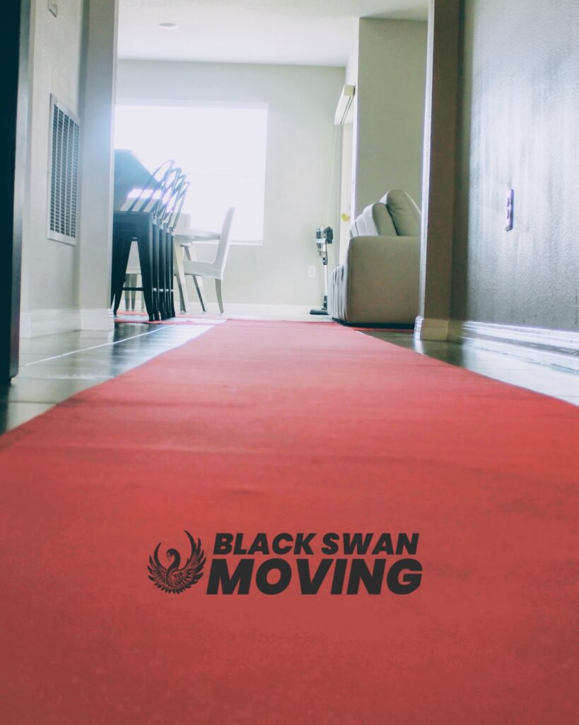 Red floor runner protecting a home's floors and doorway during a Black Swan Moving job