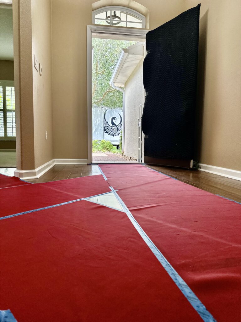 Protective floor runners laid through a home's entryway