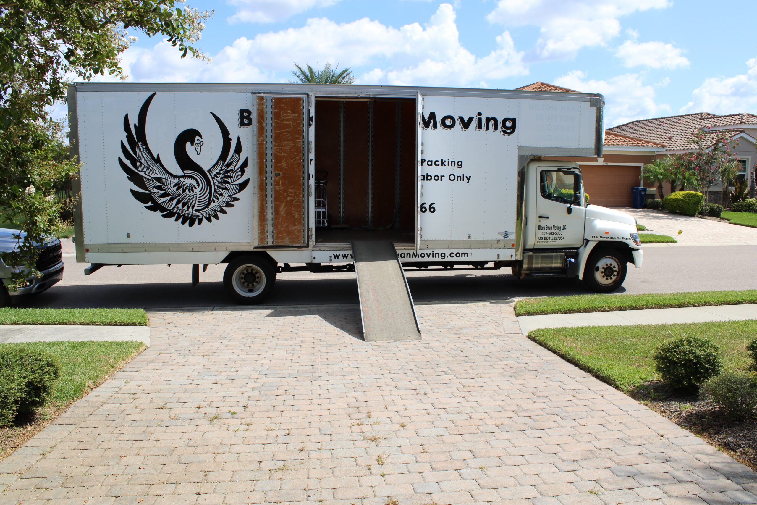 Black Swan Moving truck positioned at a Central Florida residence