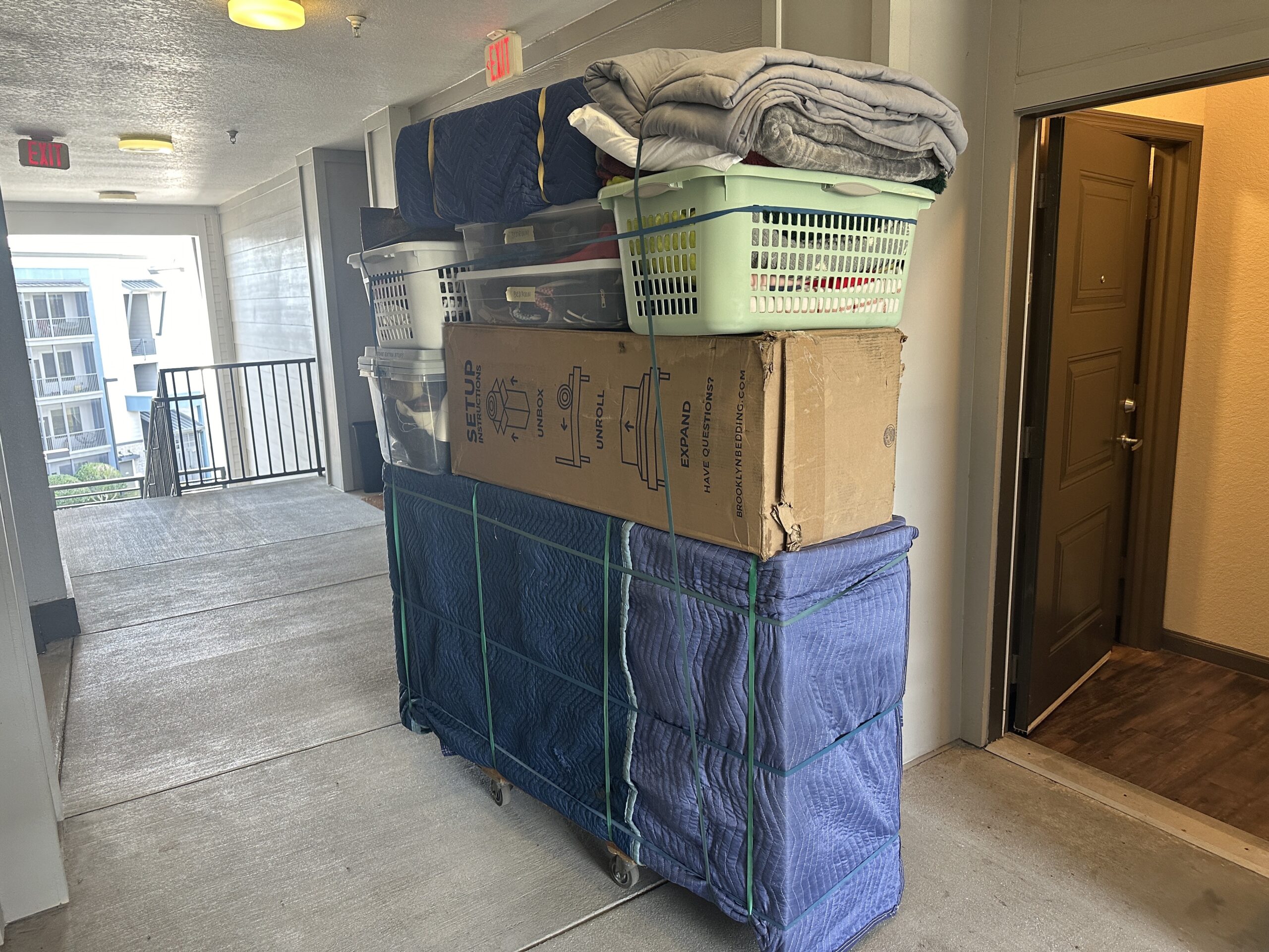 Protected moving load on a rolling cart during an apartment long carry