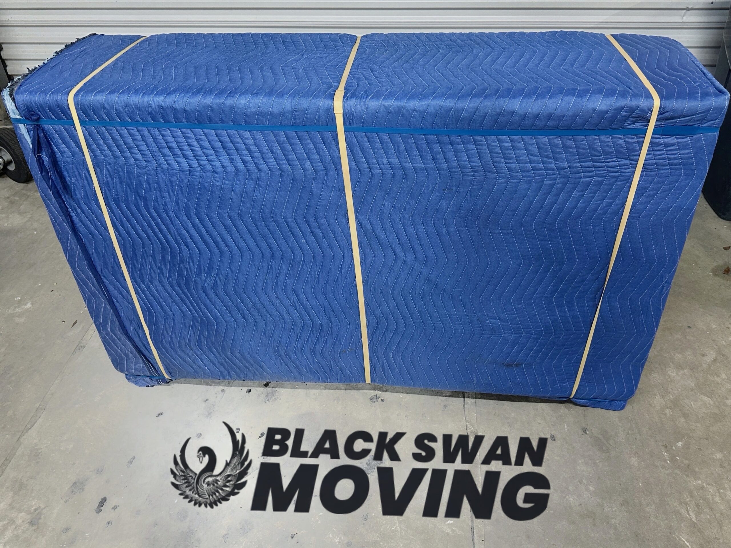 Furniture fully wrapped and secured by Black Swan Moving for safe transportation