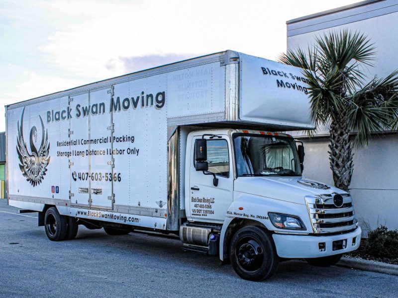 Black Swan Moving truck parked